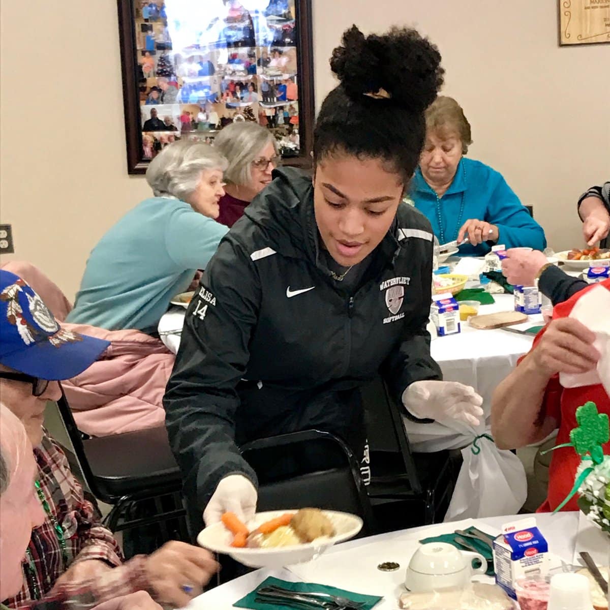 Varsity Softball team helping out down at the Watervliet Senior Center