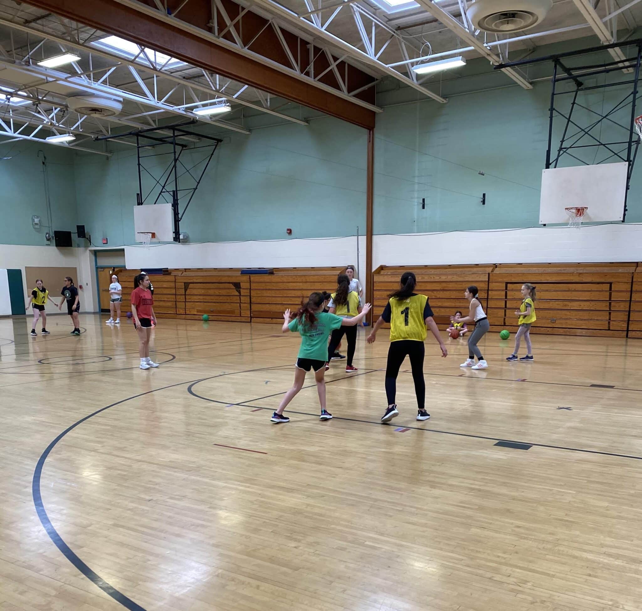 Minisink Valley girls varsity basketball volunteer at youth instructional basketball clinic