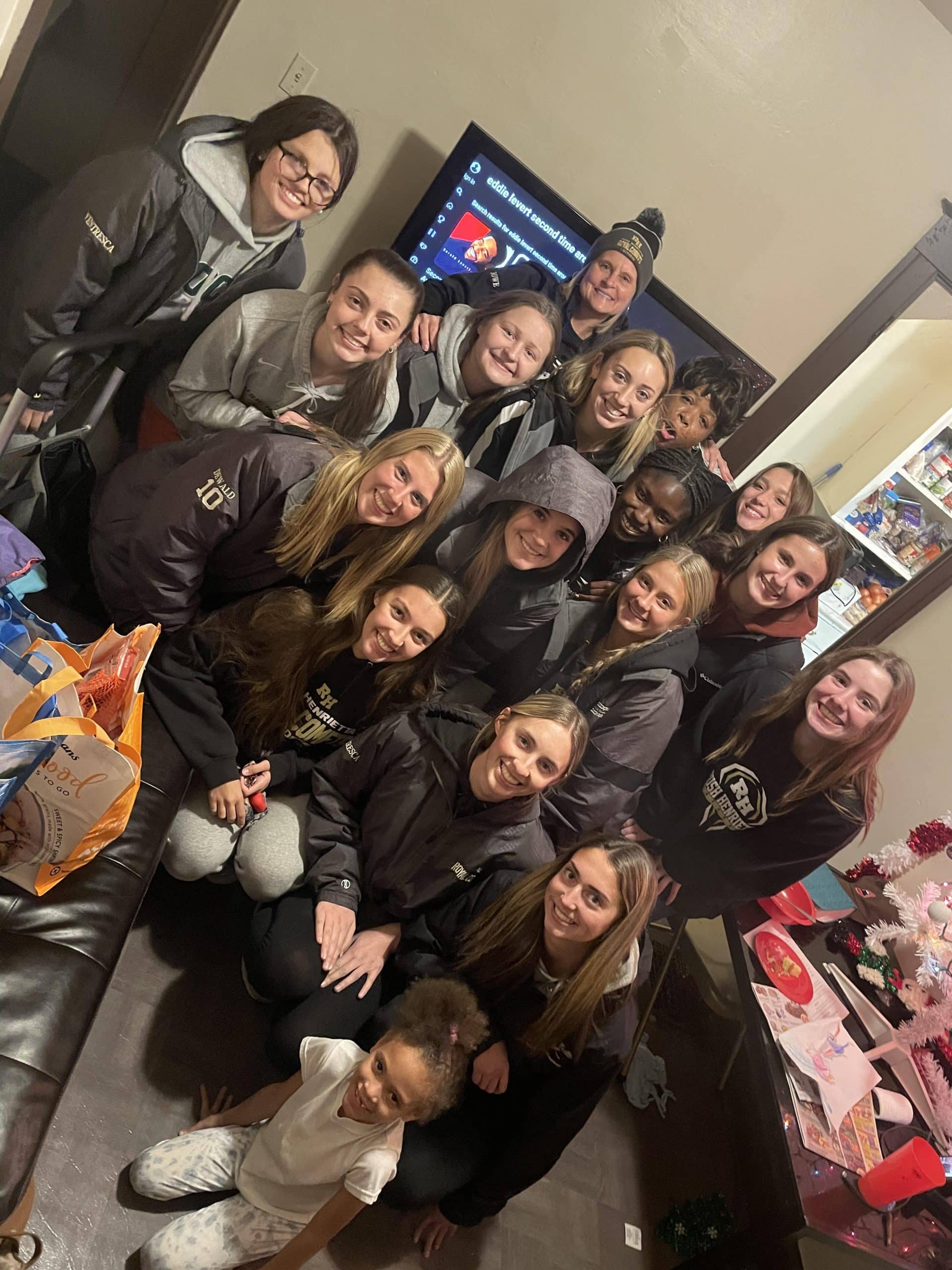 RushHenrietta Girls Lacrosse varsity team give back to the community